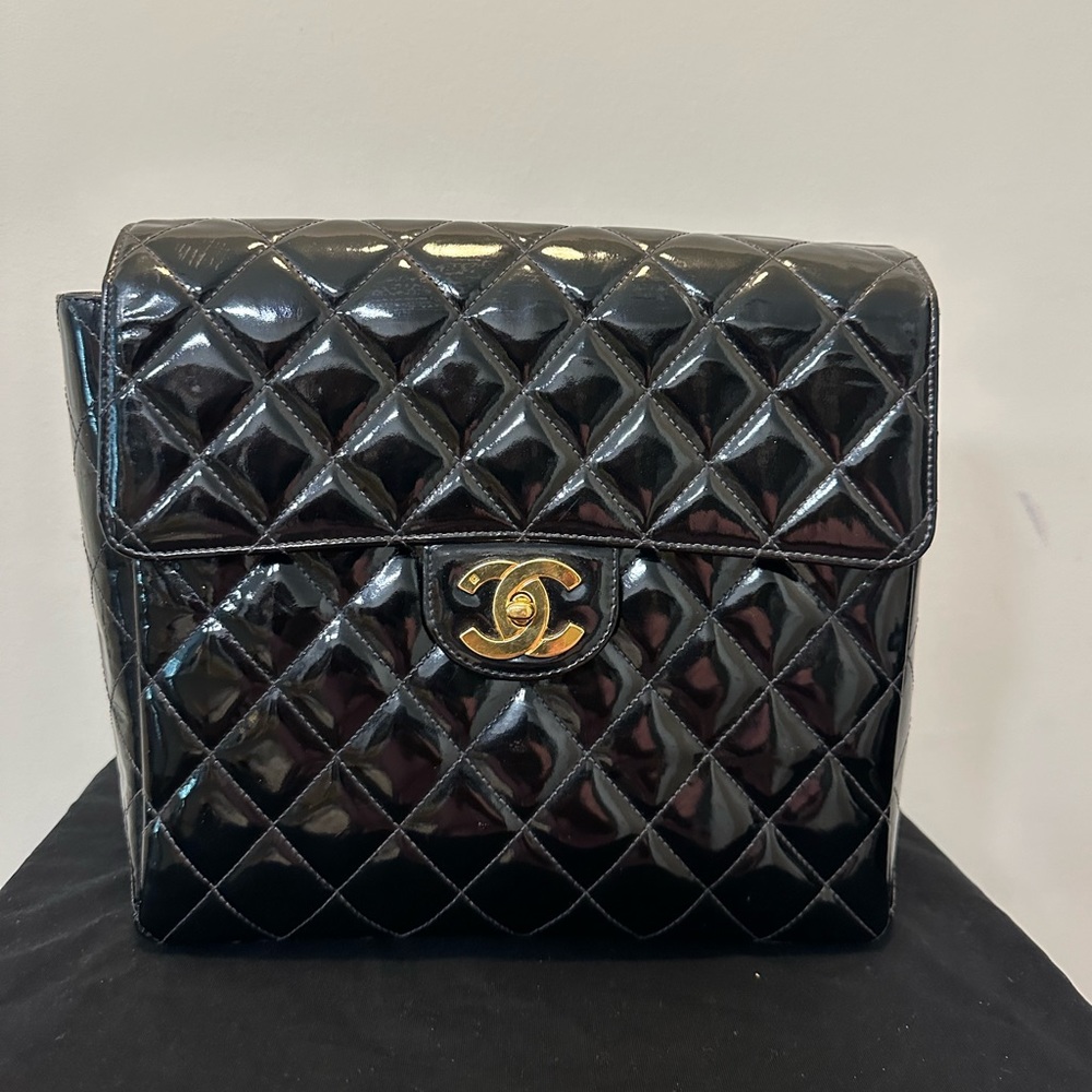 Vintage Chanel backpack patent leather with gold hardware on the straps